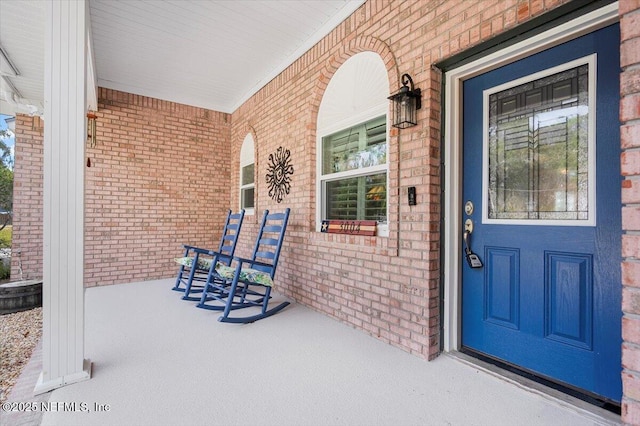 doorway to property with a porch