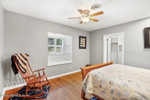 bedroom featuring light hardwood / wood-style floors and ceiling fan