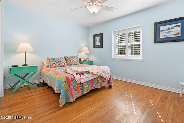 bedroom with wood-type flooring and ceiling fan