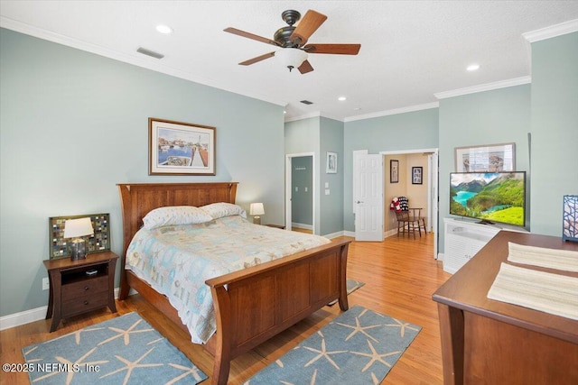 bedroom with crown molding, wood-type flooring, and ceiling fan