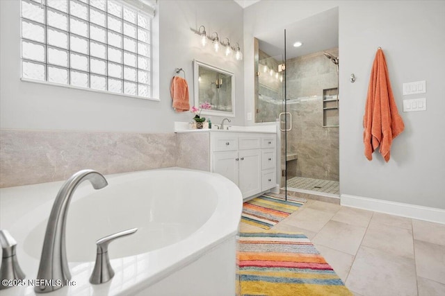 bathroom featuring vanity, independent shower and bath, and tile patterned flooring