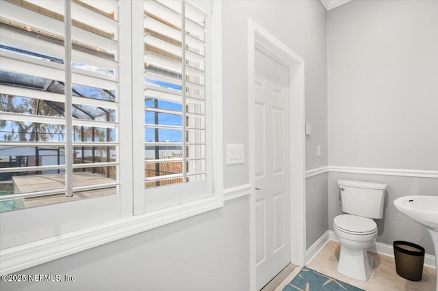 bathroom with tile patterned floors and toilet