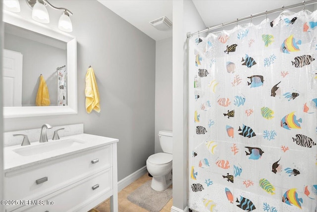 bathroom featuring vanity, tile patterned flooring, a shower with curtain, and toilet