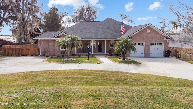 ranch-style home with a garage and a front lawn