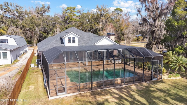 view of swimming pool with a yard, a lanai, and a patio area