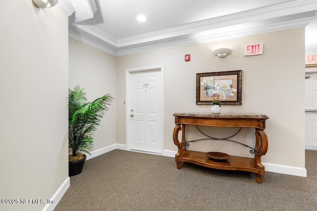 hallway featuring ornamental molding and carpet