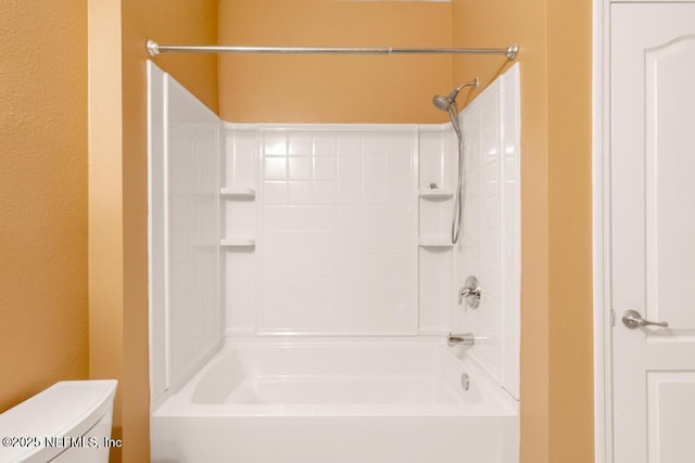 bathroom featuring toilet and tub / shower combination