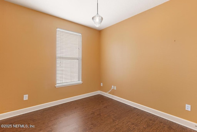 empty room with hardwood / wood-style floors