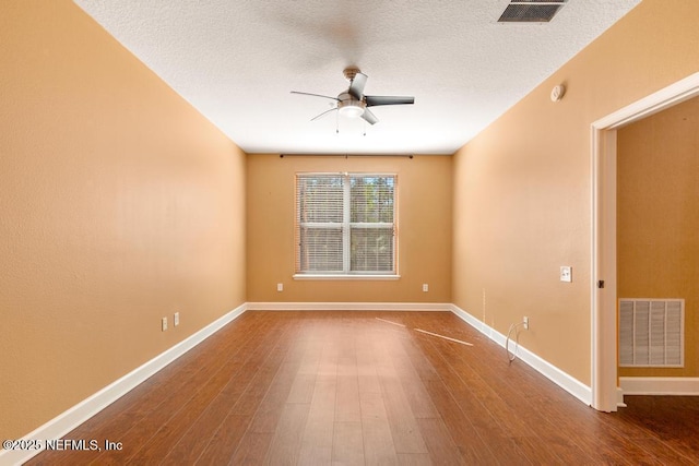 spare room with wood-type flooring, a textured ceiling, and ceiling fan