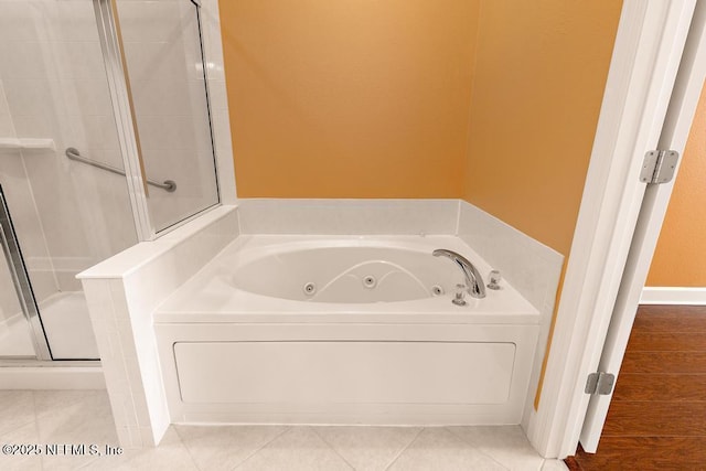 bathroom featuring tile patterned flooring and independent shower and bath