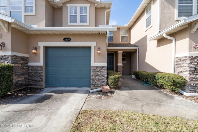 view of exterior entry featuring a garage