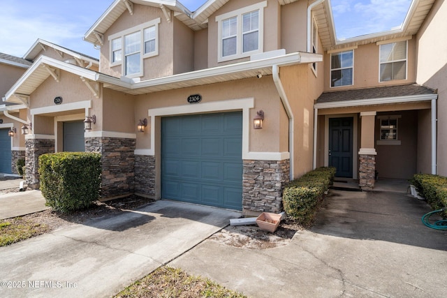 multi unit property featuring a garage