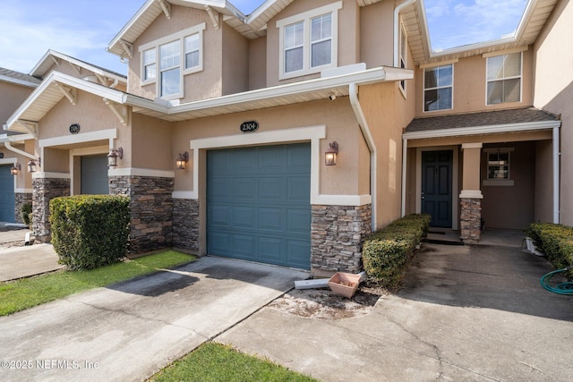 townhome / multi-family property featuring a garage