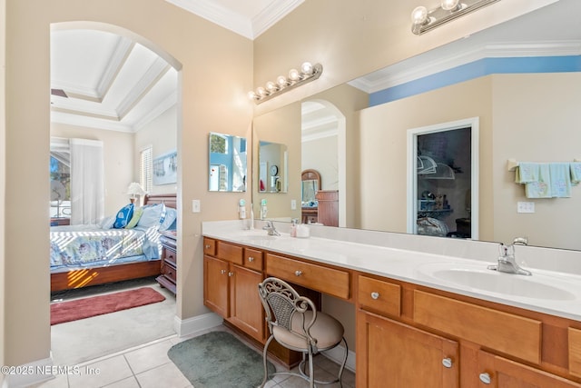 bathroom featuring ornamental molding, tile patterned floors, and vanity