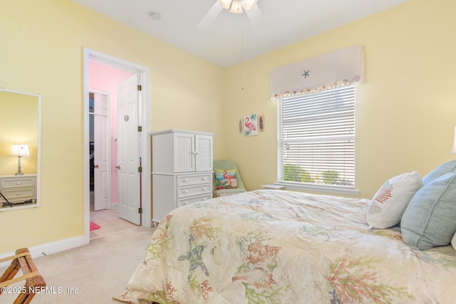 bedroom with light colored carpet and ceiling fan