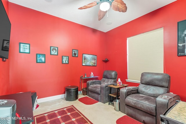 carpeted home theater room featuring ceiling fan