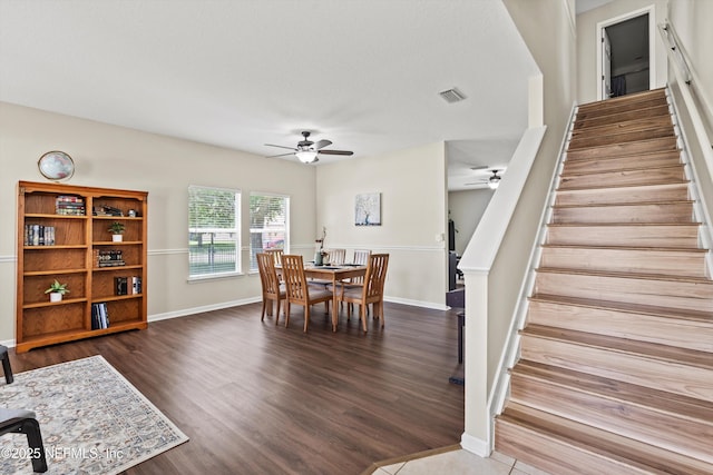 2360 Golfview Dr, Fleming Island, FL 32003 - dining room with a ceiling fan, stairway, wood finished floors, and baseboards