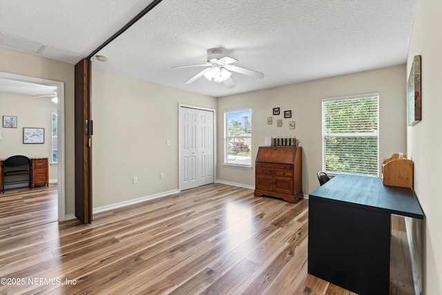 2360 Golfview Dr, Fleming Island, FL 32003 - office featuring ceiling fan, healthy amount of natural light, light wood-style floors, a textured ceiling, and baseboards