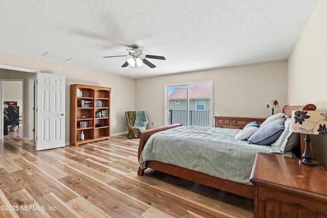 2360 Golfview Dr, Fleming Island, FL 32003 - bedroom featuring light wood finished floors, a textured ceiling, and ceiling fan