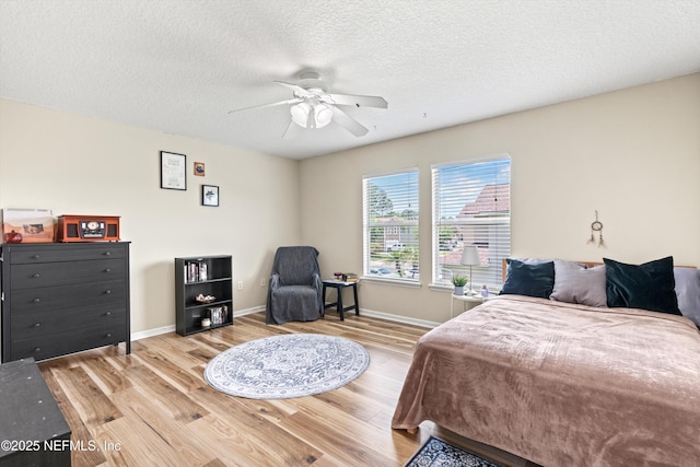 2360 Golfview Dr, Fleming Island, FL 32003 - bedroom with wood finished floors, baseboards, a textured ceiling, and ceiling fan