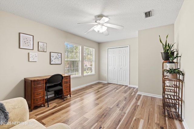 2360 Golfview Dr, Fleming Island, FL 32003 - office space featuring light wood-type flooring, ceiling fan, baseboards, and a textured ceiling
