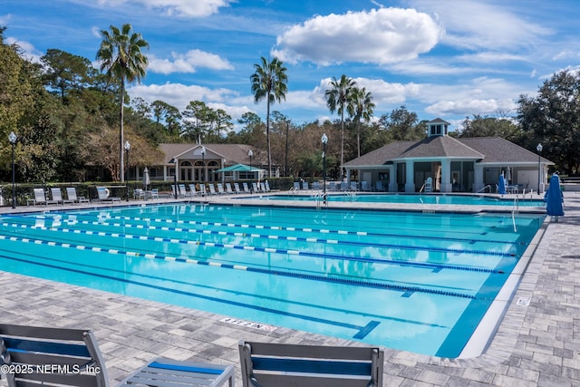 2360 Golfview Dr, Fleming Island, FL 32003 - community pool featuring view of scattered trees and a patio