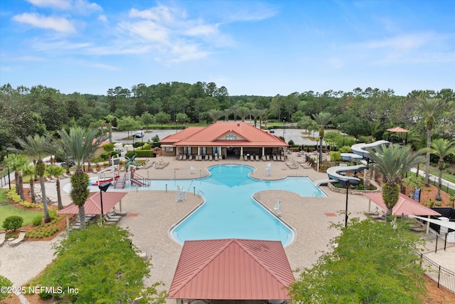 2360 Golfview Dr, Fleming Island, FL 32003 - community pool with a water slide, view of wooded area, and a patio