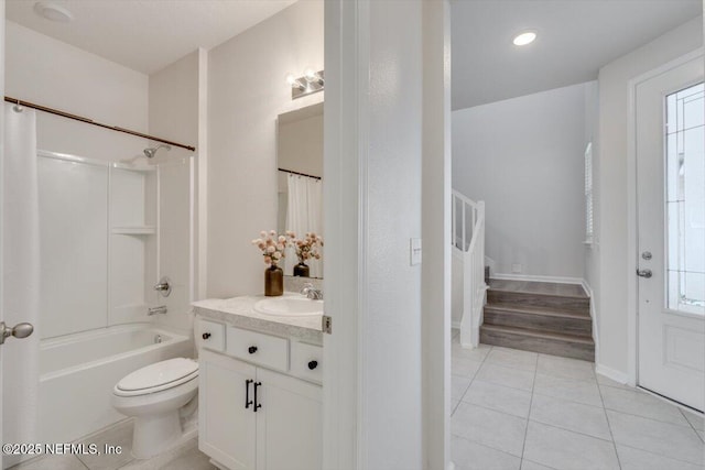 full bathroom featuring tile patterned flooring, vanity, bathing tub / shower combination, and toilet