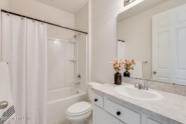 full bathroom with vanity, shower / bath combination with curtain, and toilet