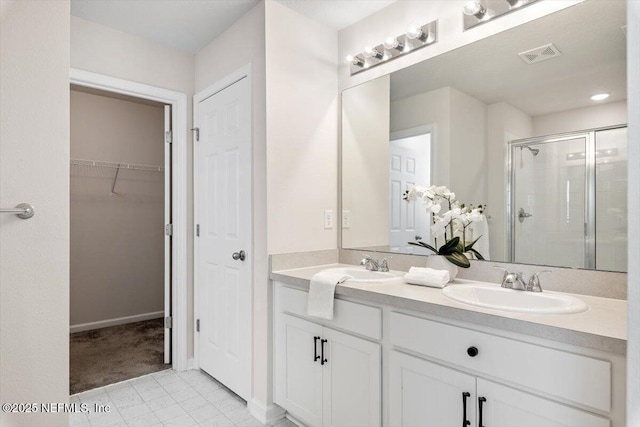 bathroom featuring vanity and an enclosed shower