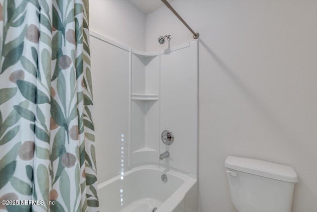 bathroom featuring shower / bathtub combination with curtain and toilet