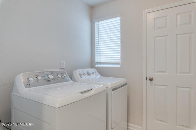 laundry room featuring washing machine and clothes dryer