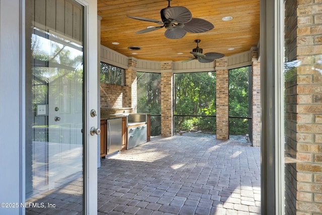 view of patio / terrace featuring area for grilling and a ceiling fan