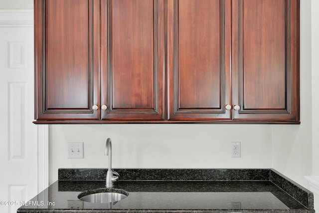 kitchen with dark stone countertops