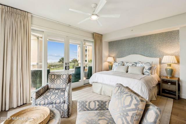 bedroom featuring french doors, ceiling fan, access to exterior, and light hardwood / wood-style flooring