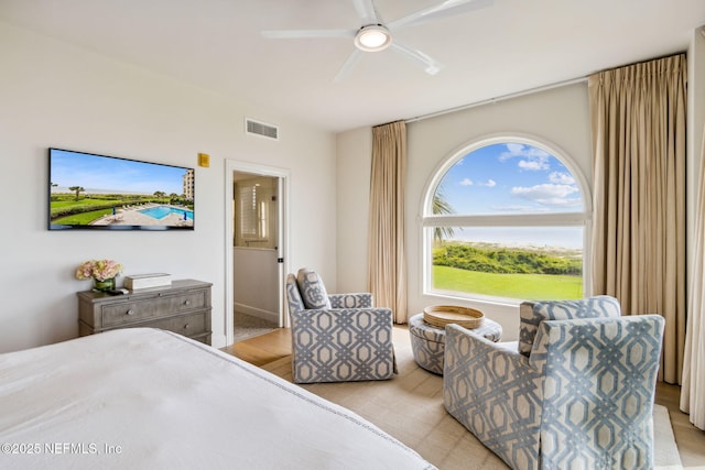 bedroom featuring ensuite bathroom and ceiling fan