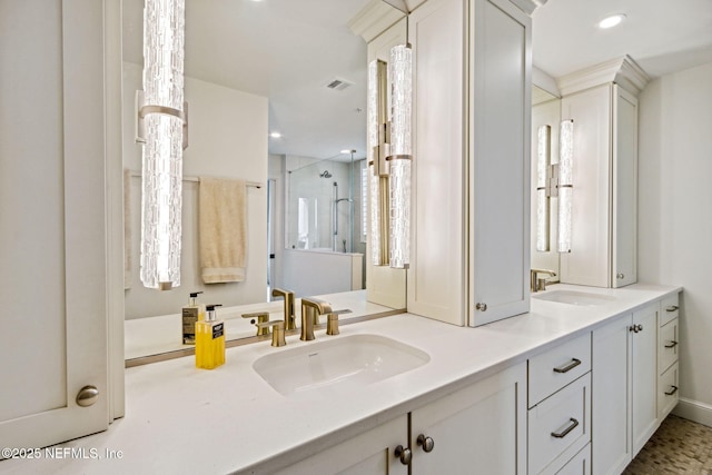 bathroom with vanity and an enclosed shower