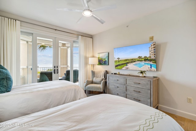 bedroom with light hardwood / wood-style flooring, access to outside, french doors, and ceiling fan