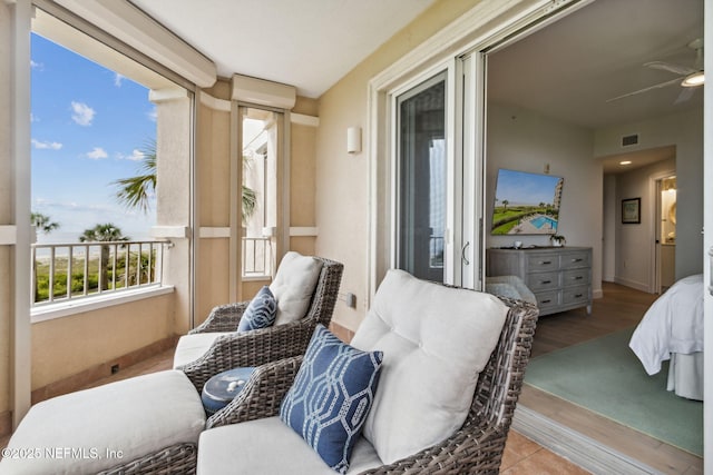 balcony featuring ceiling fan