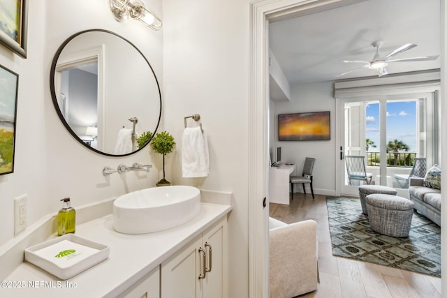 bathroom featuring vanity, hardwood / wood-style floors, and ceiling fan