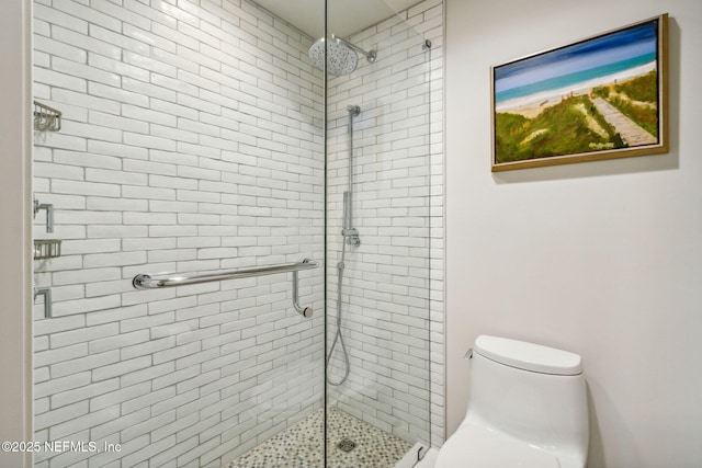 bathroom featuring toilet and walk in shower