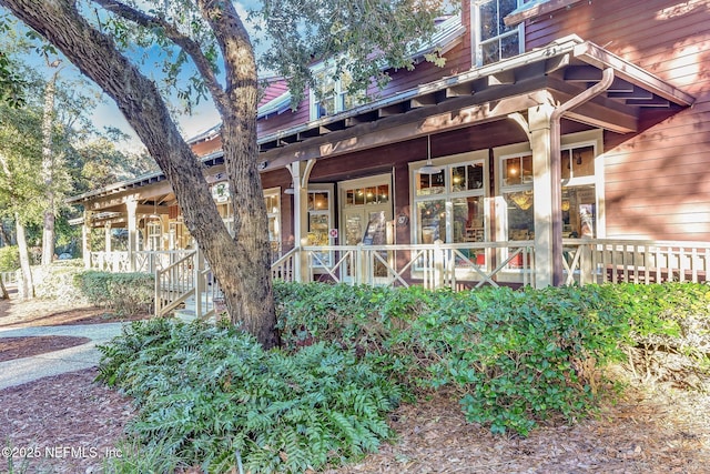 property entrance featuring covered porch