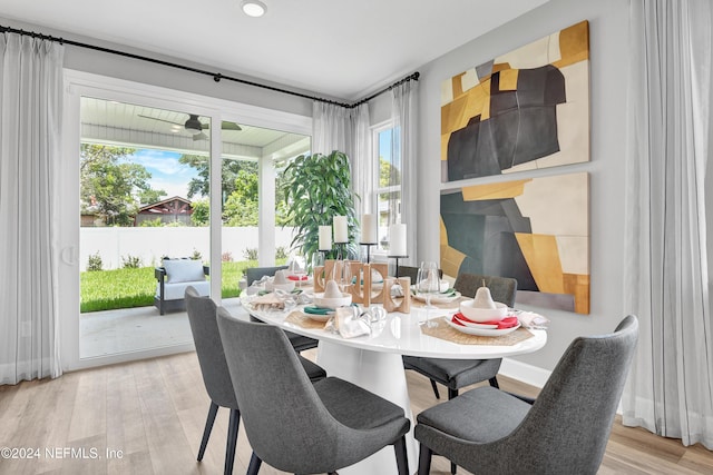 dining space with light hardwood / wood-style flooring