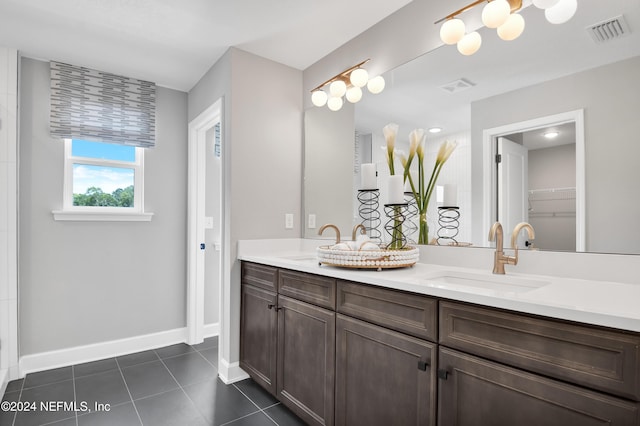 bathroom featuring tile patterned flooring and vanity