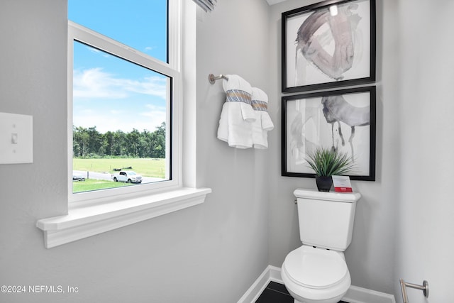 bathroom with tile patterned flooring and toilet