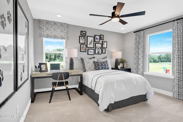 carpeted bedroom with ceiling fan