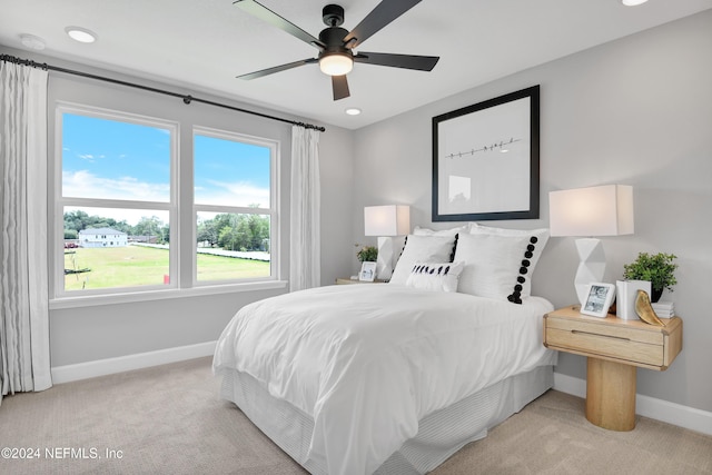 carpeted bedroom featuring ceiling fan