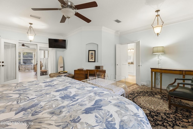 bedroom featuring ornamental molding, visible vents, and baseboards