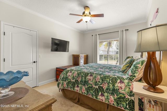 bedroom with a textured ceiling, light carpet, a ceiling fan, baseboards, and ornamental molding