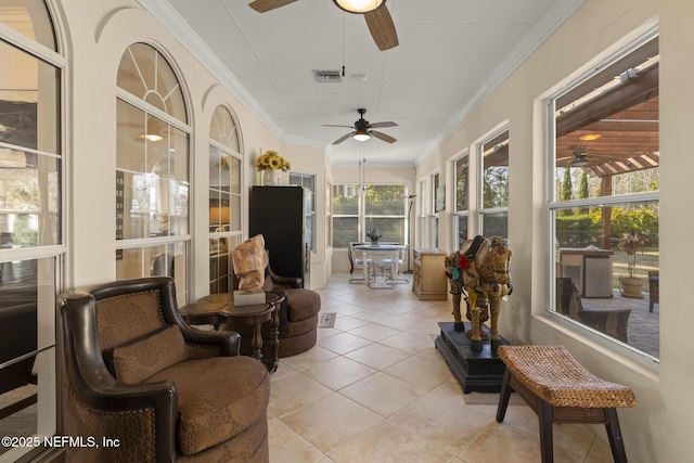 sunroom featuring ceiling fan and visible vents